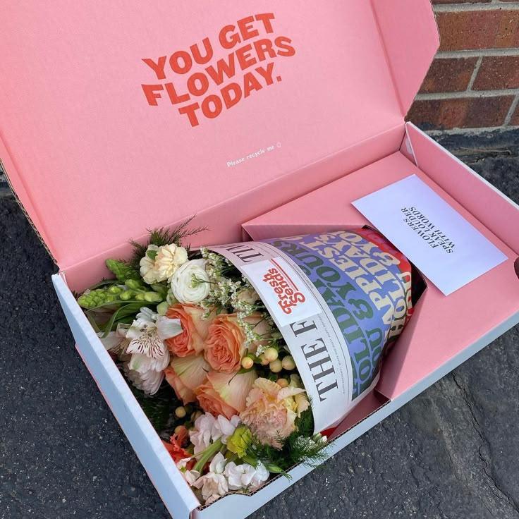 PlainPavilionHub workshop space where corporate flower arrangements are designed and prepared for business delivery